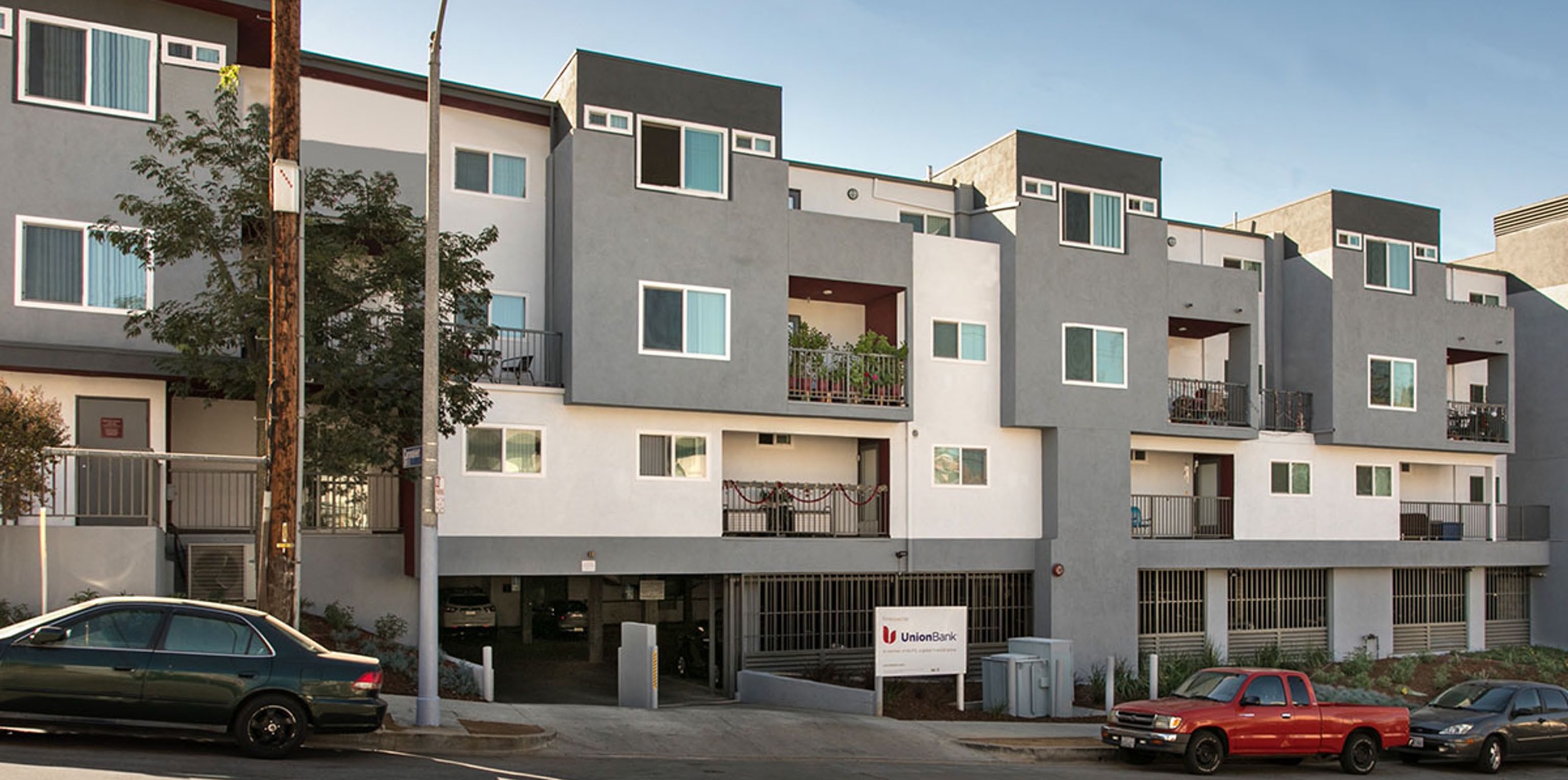A building with a parking lot AI-generated content may be incorrect.